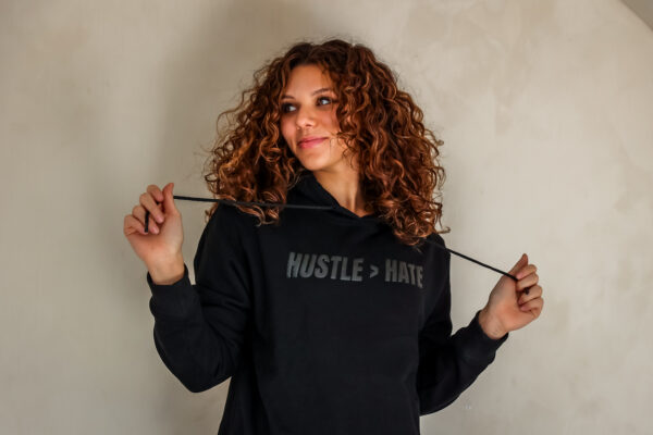 HUSTLE > HATE HOODIE - BLACK (MCKENZIE MATHURIN COLLECTION) - Image 2